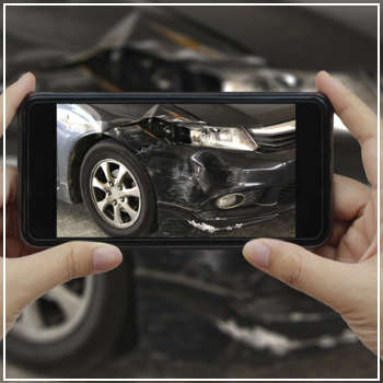 taking photo of car accident damage