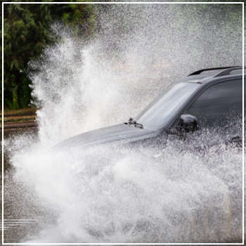 car driving on a flooded road 