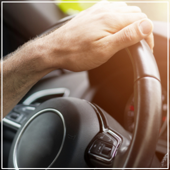 hand on steering wheel