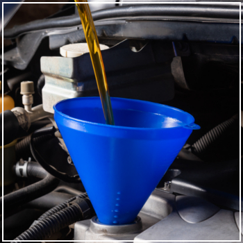 pouring oil into vehicle