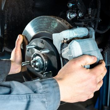 technician checking brakes