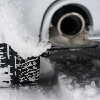 car tire and exhaust on snow