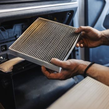 taking out dirty air filter in car