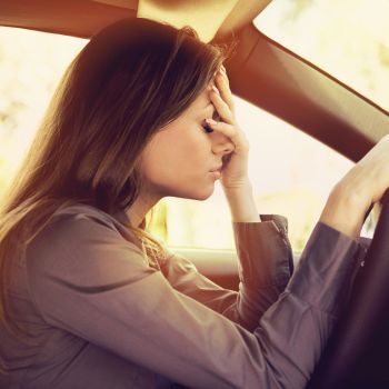 stressed female driver inside her car