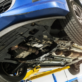 vehicle up on lift in repair shop